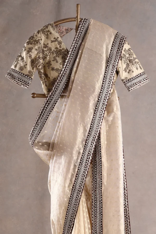 butter cream tissue organza saree with sequins, zari, and dori embroidery