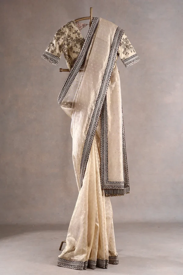 butter cream tissue organza saree with sequins, zari, and dori embroidery