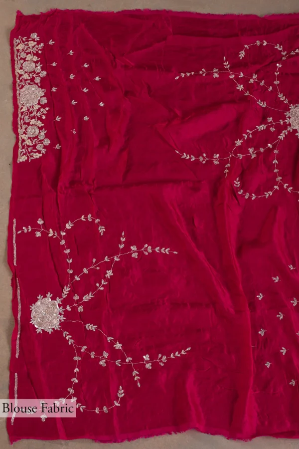 crimson red crepe saree with stone, sequins, pearl, and cutdana embroidery