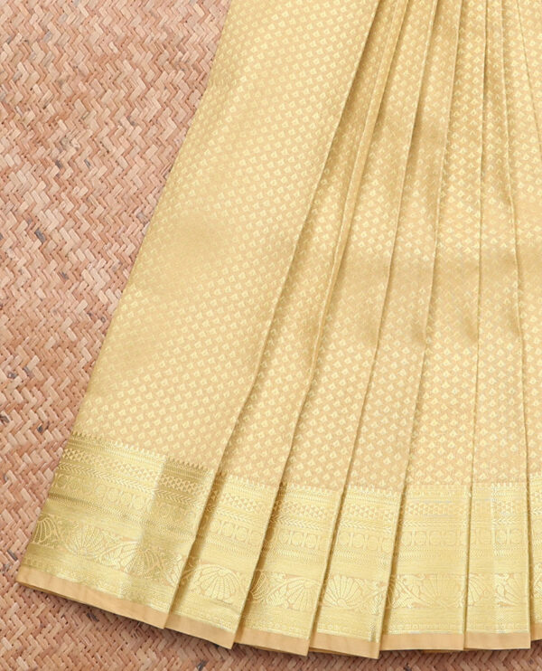 gold art silk saree with traditional border and intricate pallu