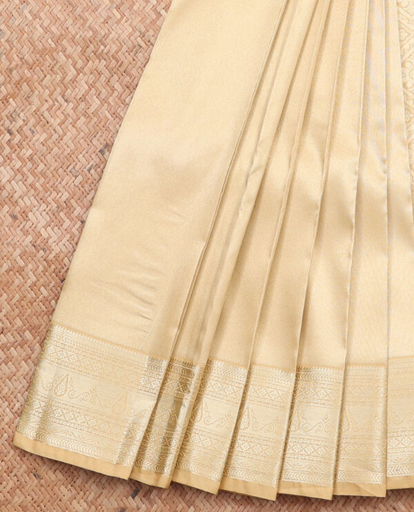 gold art silk saree with traditional border and jaal pallu