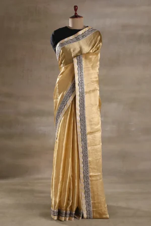 gold tissue organza saree with black & gold embroidered border