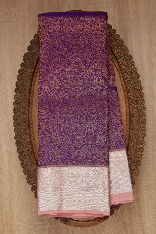 grape purple kanchipuram silk saree with pastel peach & silver zari woven border