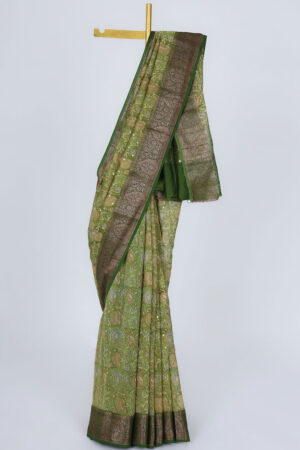 green chanderi saree with floral print, mirror embroidery, and contrast border