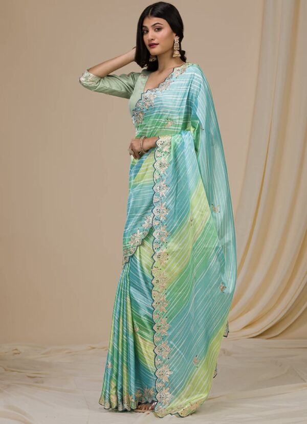 green semi crepe printed embroidered saree