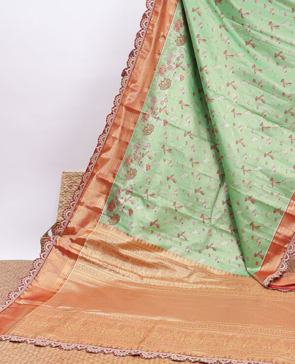 green semi tissue saree with patch embroidery border and jaal design pallu