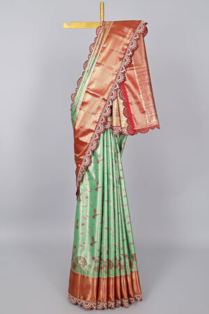 green semi tissue saree with patch embroidery border and jaal design pallu