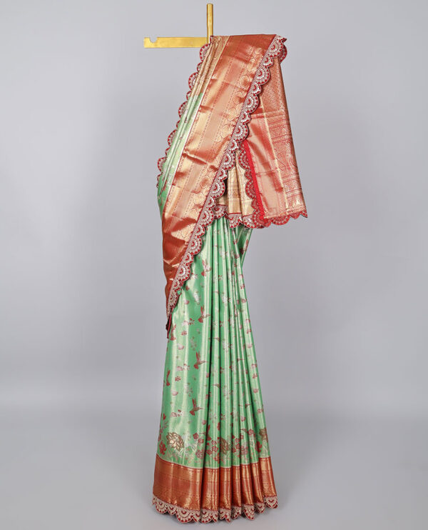 green semi tissue saree with patch embroidery border and jaal design pallu