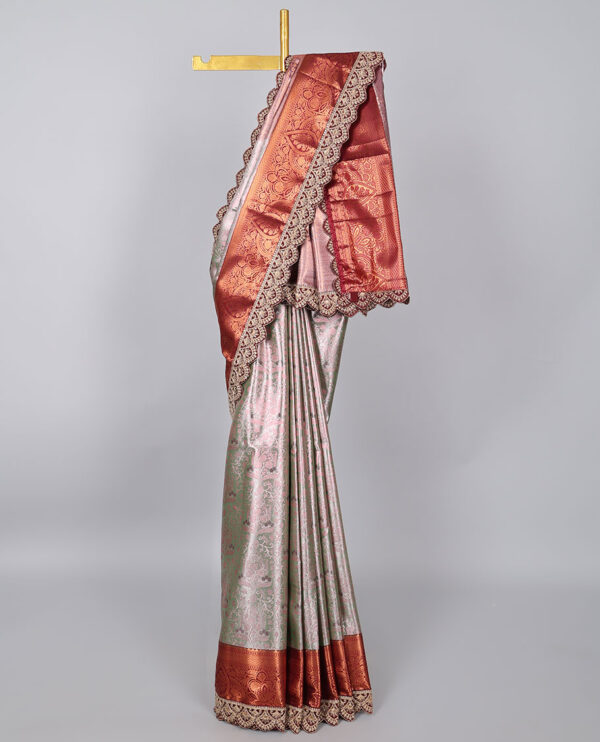 green semi tissue saree with patch embroidery border and floral motifs