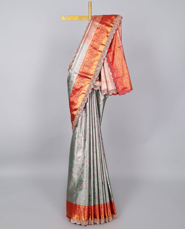 green semi tissue saree with patch embroidery border and intricate design pallu