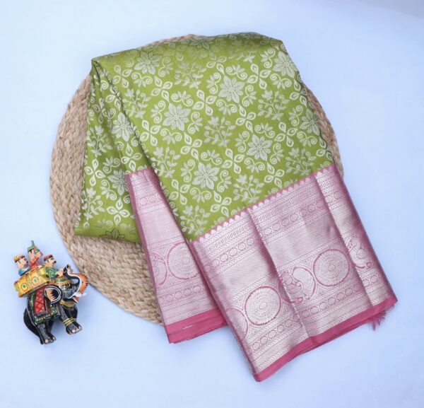 leaf green kanjivaram silk saree with pink zari border