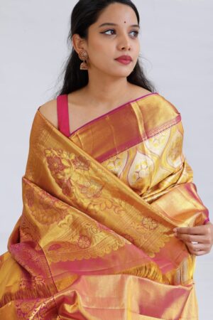 light gold kanjivaram silk saree with pink zari border