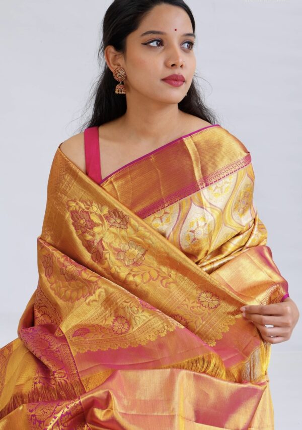 light gold kanjivaram silk saree with pink zari border