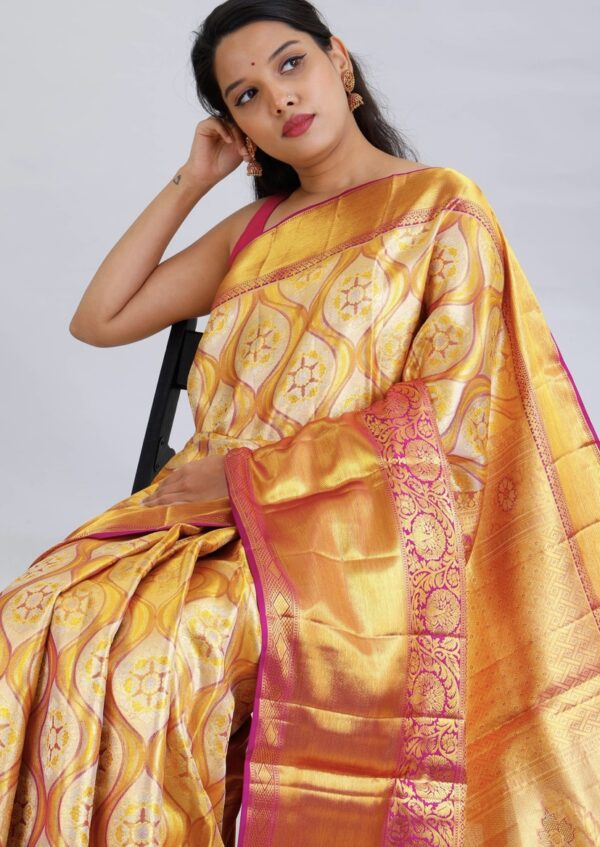 light gold kanjivaram silk saree with pink zari border