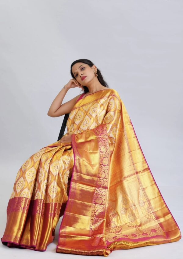 light gold kanjivaram silk saree with pink zari border