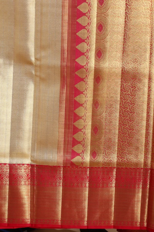 gold kanchipuram tissue saree with red & pink dual tone zari woven border