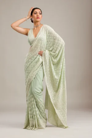 pista green georgette saree with intricate threadwork and embroidery