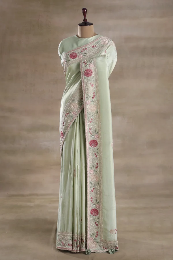 silver green tissue saree with multicolor embroidered border