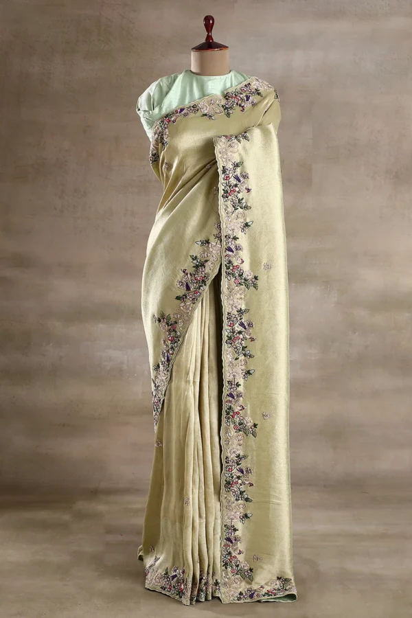 gold tissue organza saree with black & gold embroidered border