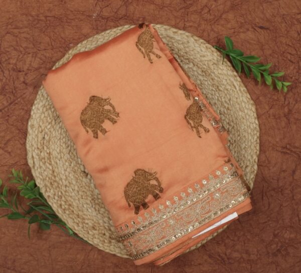 sunrise orange silk saree with elephant motif and intricate weaving