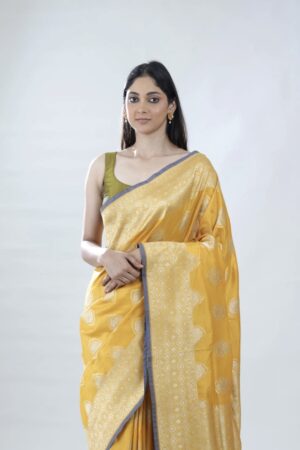 turmeric yellow banarasi silk saree with intricate zari weaving