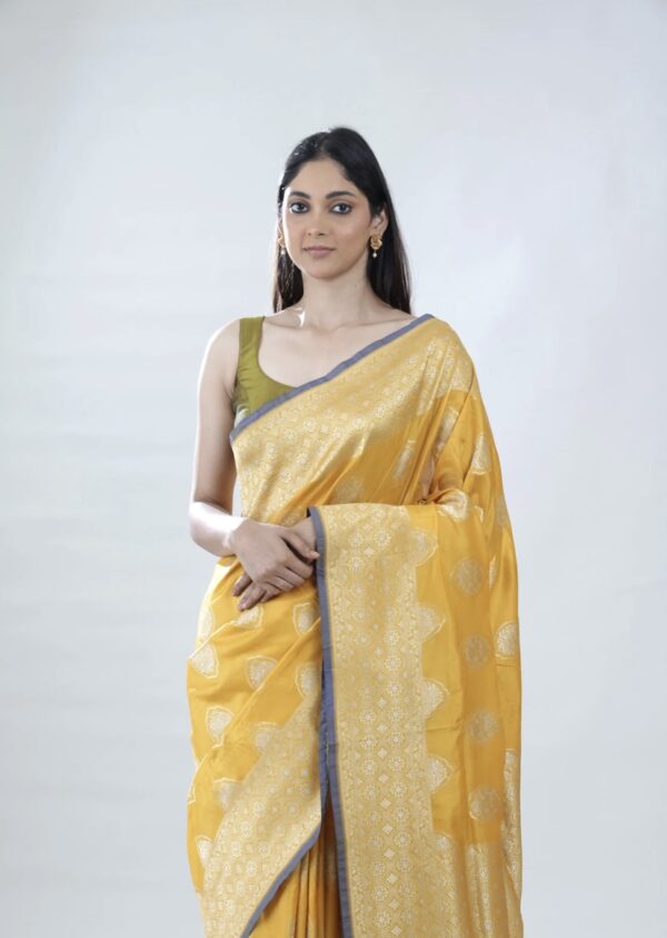 turmeric yellow banarasi silk saree with intricate zari weaving