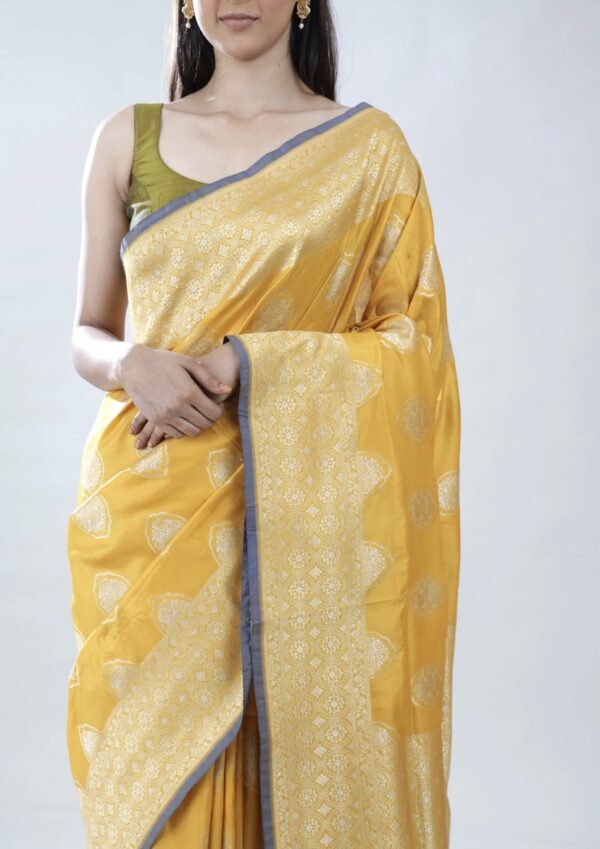 turmeric yellow banarasi silk saree with intricate zari weaving