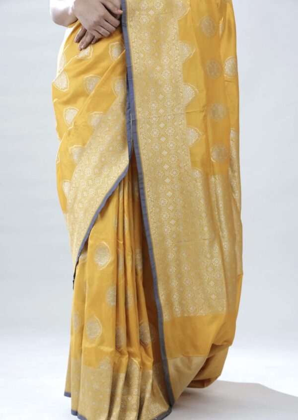 turmeric yellow banarasi silk saree with intricate zari weaving