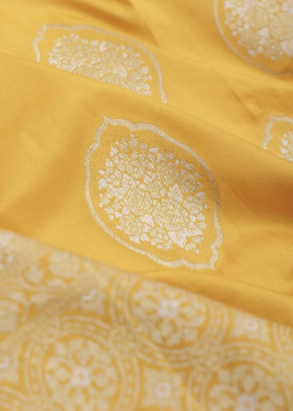 turmeric yellow banarasi silk saree with intricate zari weaving