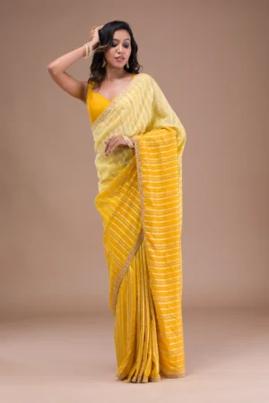 yellow organza saree with cutdana embroidery