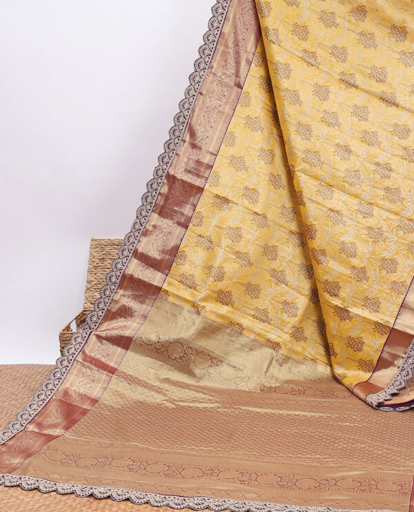 yellow semi tissue saree with patch work border and floral motifs