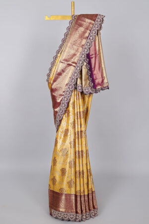 yellow semi tissue saree with patch work border and floral motifs