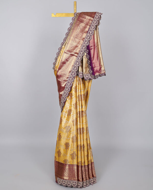 yellow semi tissue saree with patch work border and floral motifs